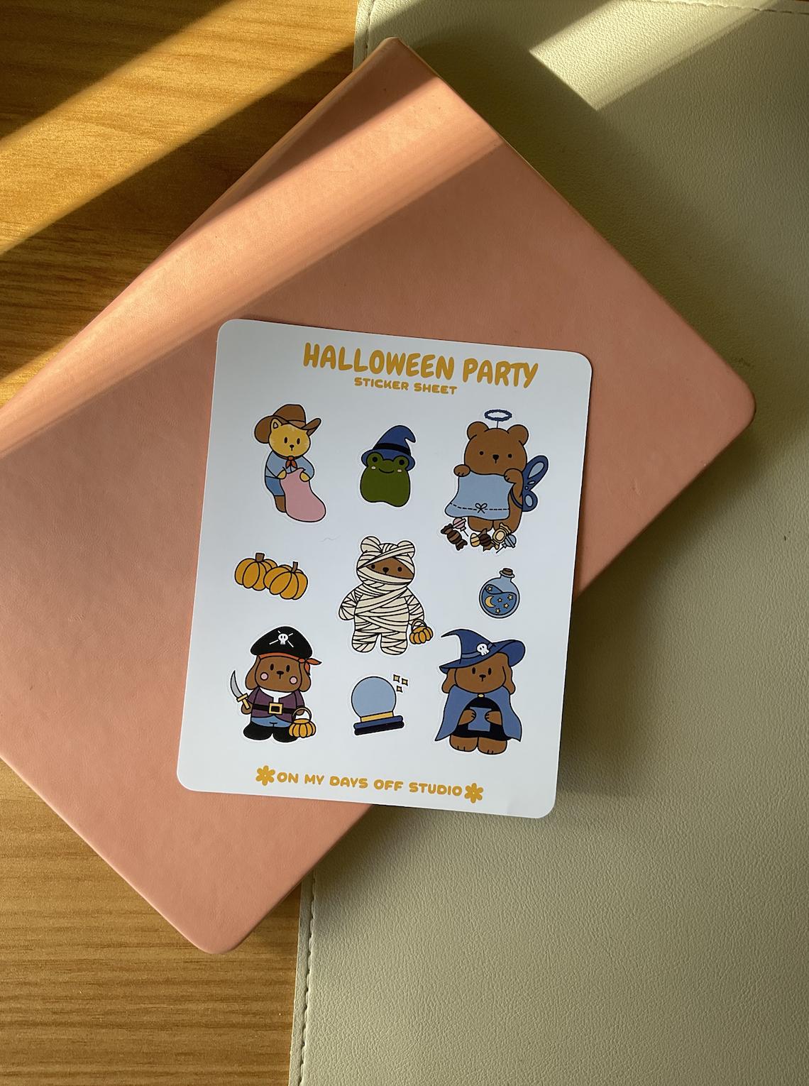 This stationery sticker sheet features a Halloween costume theme and has 9 colorful illustrations. These illustrations feature cute characters in Halloween costumes likes a fairy bear, bear mummy, dog wizard, dog pirate, cat cowboy and a frog witch. These glossy stickers are perfect for planners and bullet journals. 