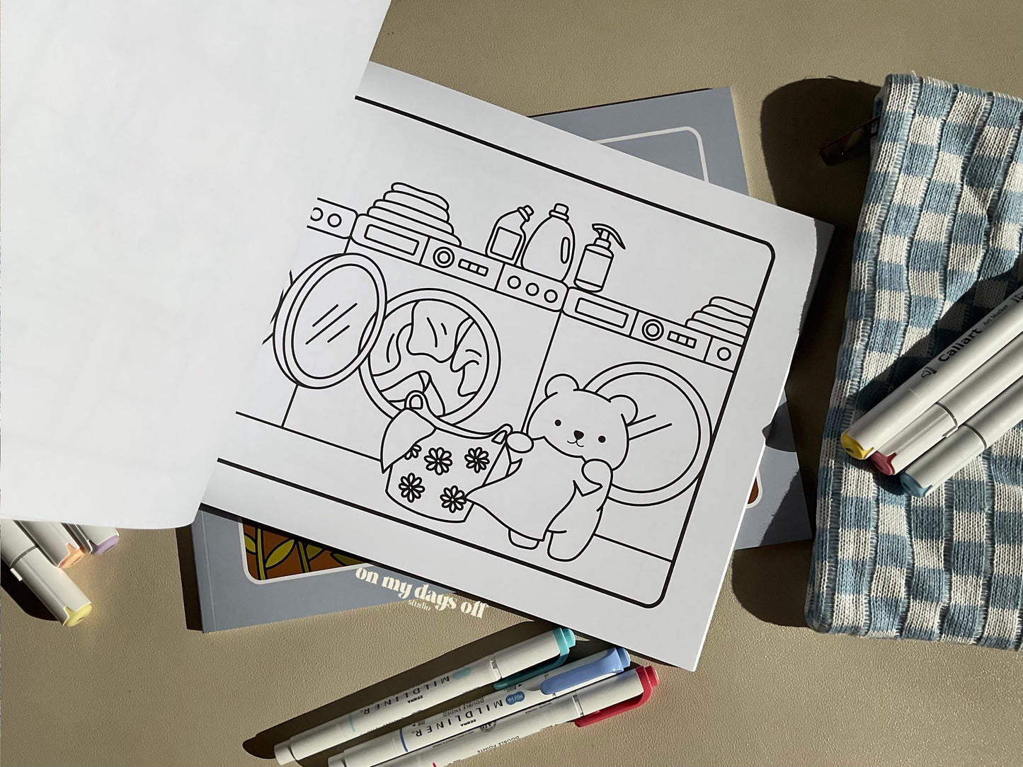 This adorable coloring book comes with 20 illustrated pages on high quality paper, which makes a perfect canvas for your coloring session. This laundry page makes it fun to color!
