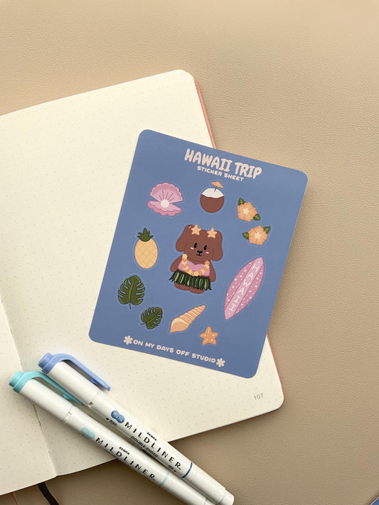 This stationery sticker sheet features a Hawaii Trip theme and has 11 colorful illustrations. This sticker sheet includes a dog in a grass skirt and other island items like a surf board, pineapple, coconut drink, and sea shells. These glossy stickers are perfect for planners and bullet journals. 