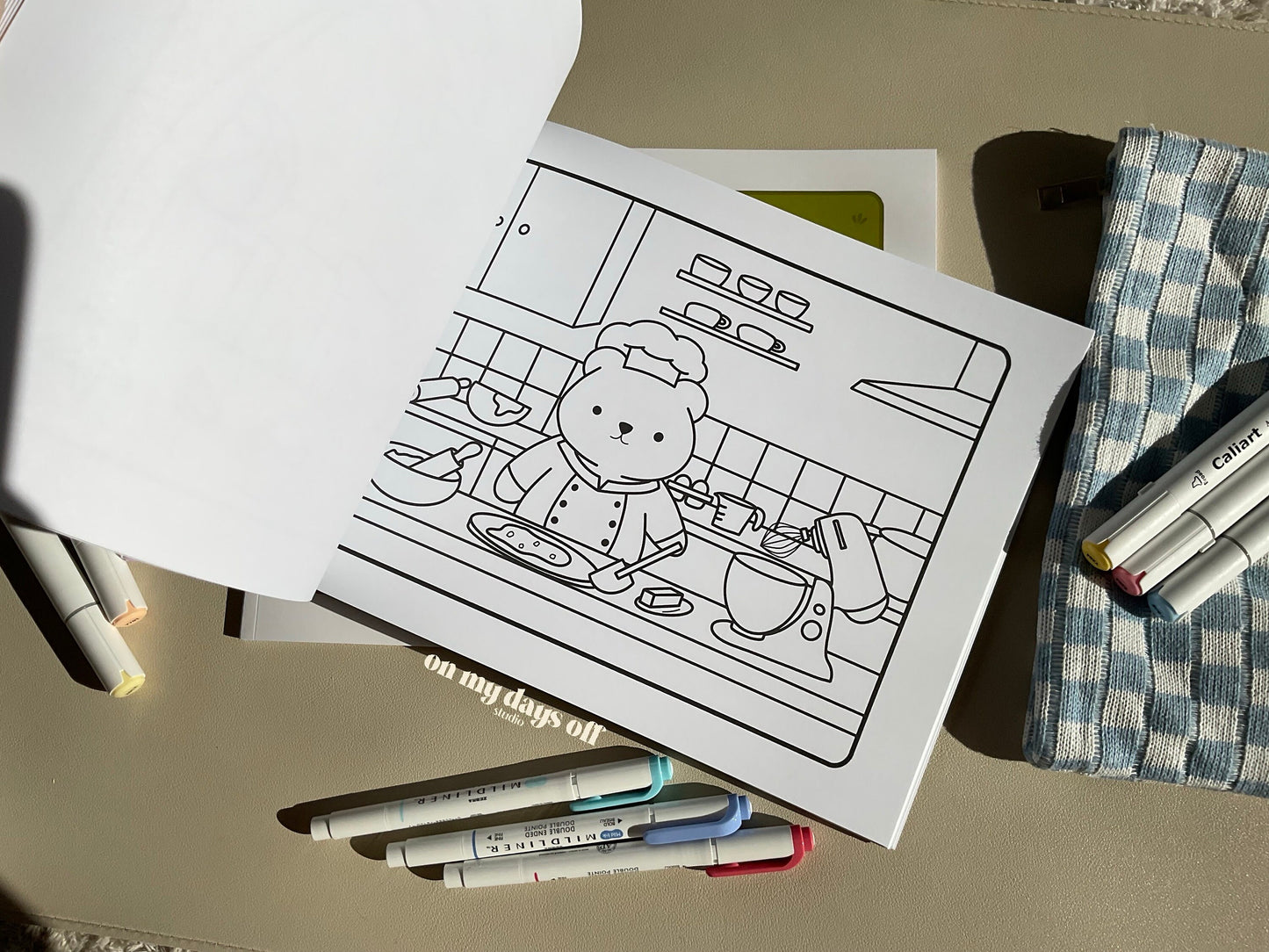 This adorable coloring book comes with 20 illustrated pages on high quality paper, which makes a perfect canvas for your coloring session. This page features a bear in the kitchen in a chefs hat and apron. This bear is baking cookies!