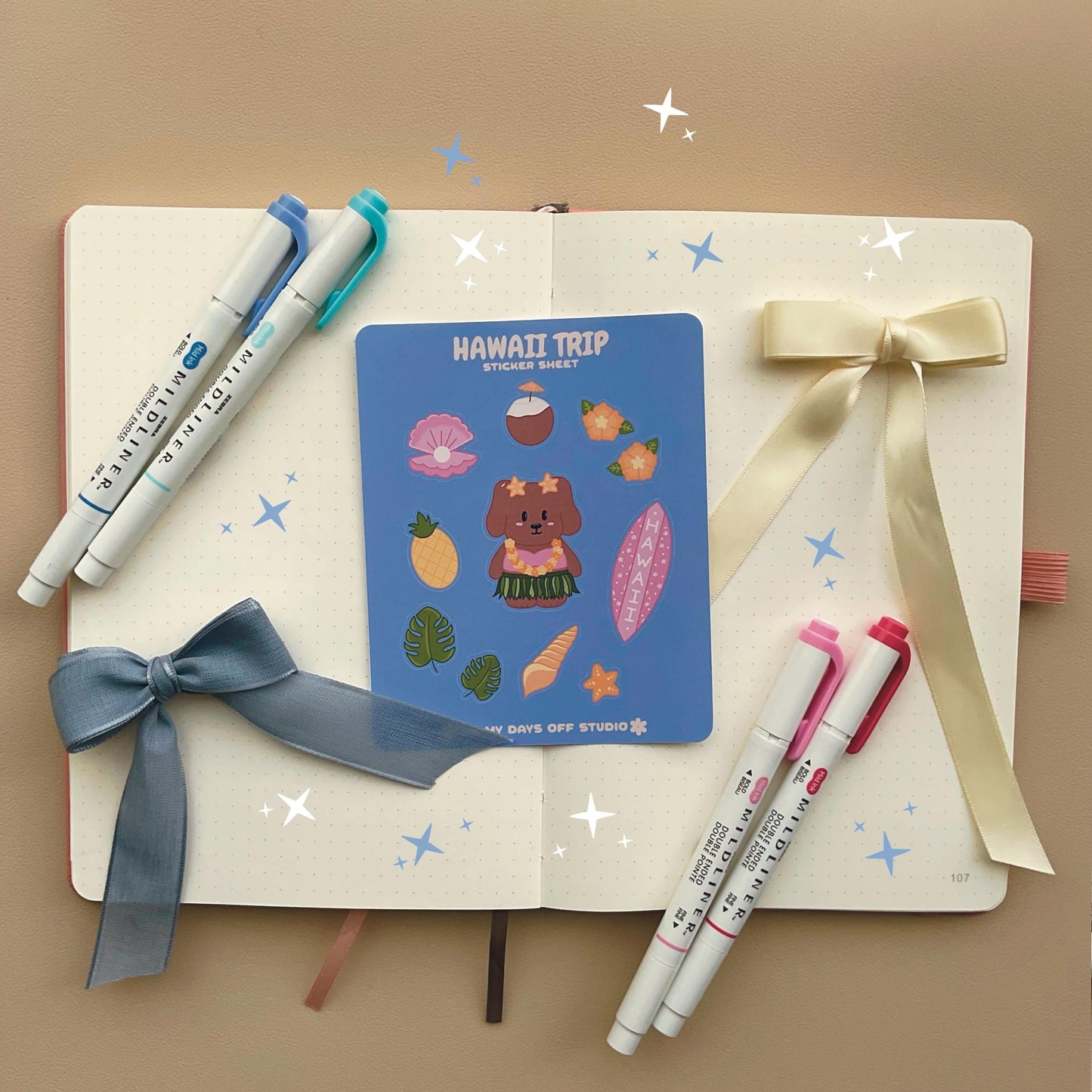 This stationery sticker sheet features a Hawaii Trip theme and has 11 colorful illustrations. This sticker sheet includes a dog in a grass skirt and other island items like a surf board, pineapple, coconut drink, and sea shells. These glossy stickers are perfect for planners and bullet journals. 
