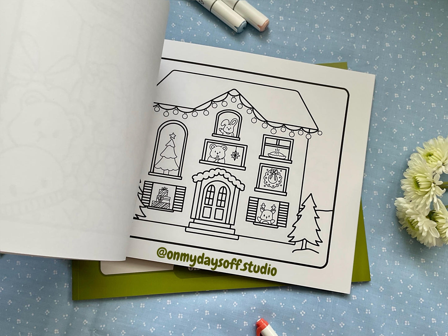 Juni and friends coloring book volume 4 is winter themed - holiday decorated house