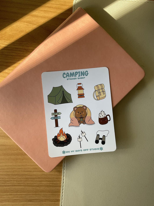 This stationery sticker sheet features a colorful camping theme and has 9 colorful illustrations, including a bear wrapped in a blanket, tent, backpack, fire pit, marshmallows and more. These glossy stickers are perfect for planners and bullet journals.&nbsp;