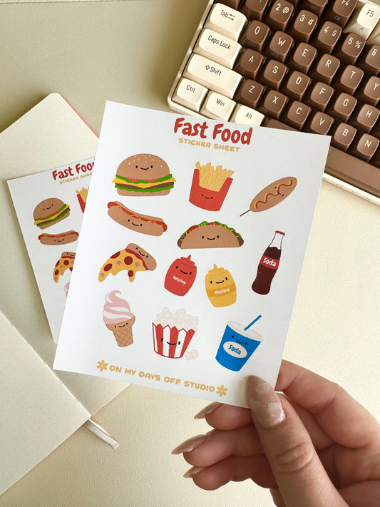 This stationery sticker sheet features an American fast food theme and has 12 colorful illustrations. These food illustrations include classics like hamburger, fries, corn dog, soda, pizza and much more. These glossy stickers are perfect for planners and bullet journals.