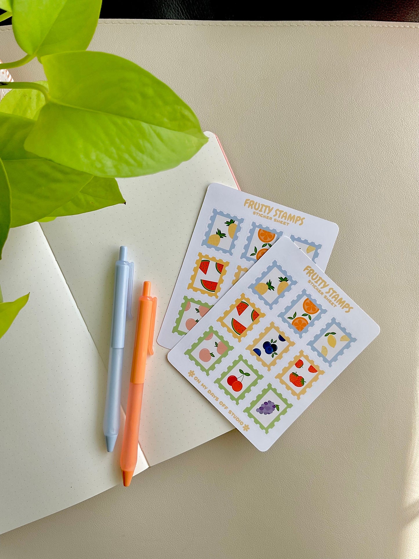 Fruit stamps sticker sheet features 9 glossy stickers with a variety of fruits such as pineapple, orange, lemon, watermelon, blueberry, strawberry, peach, cherry and grape. 