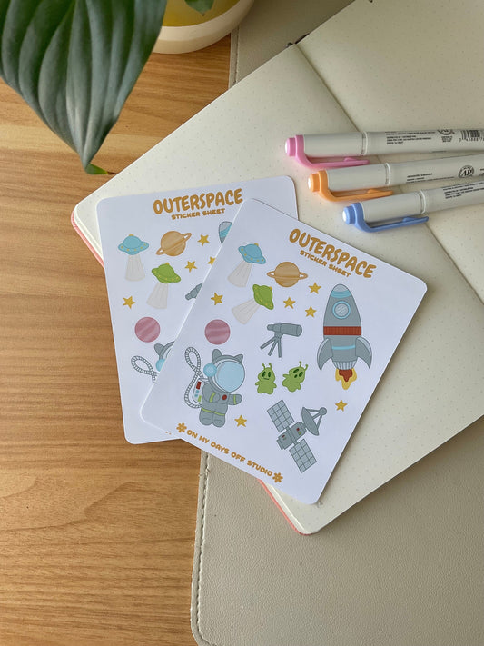 This stationery sticker sheet features a space theme and has 16 colorful illustrations, including a spaceship, cat astronaut, planets, stars, alien spaceship, and more. These glossy stickers are perfect for planners and bullet journals.&nbsp;