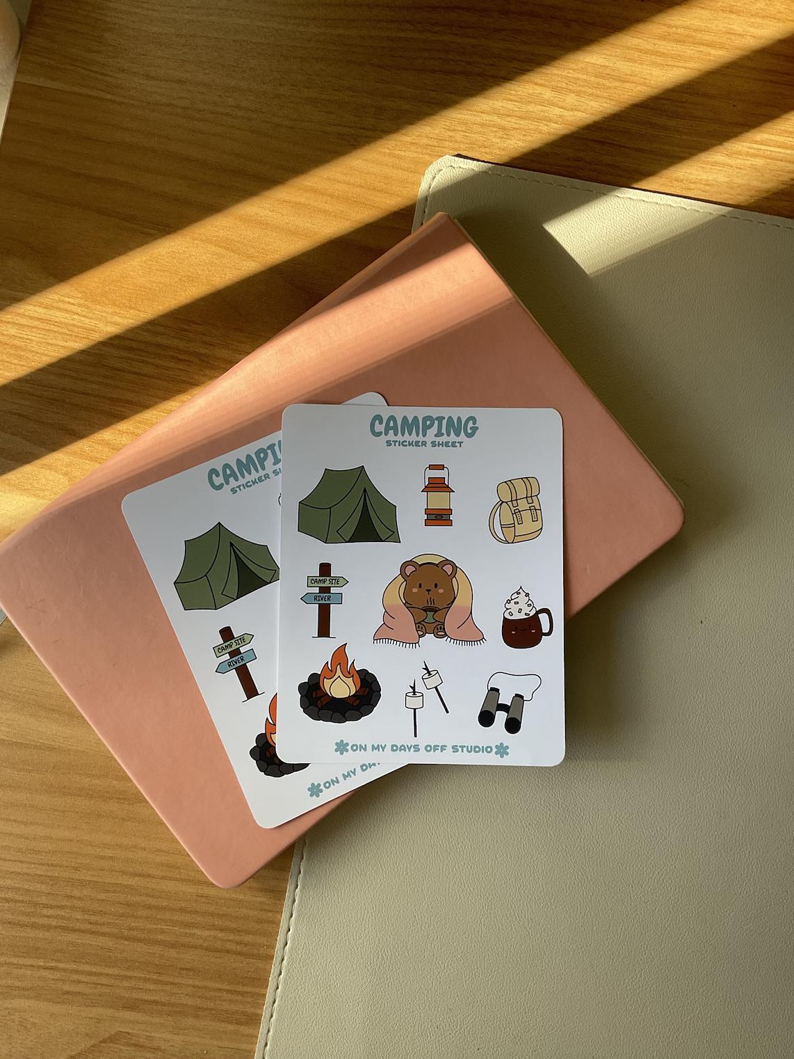 This stationery sticker sheet features a colorful camping theme and has 9 colorful illustrations, including a bear wrapped in a blanket, tent, backpack, fire pit, marshmallows and more. These glossy stickers are perfect for planners and bullet journals.&nbsp;