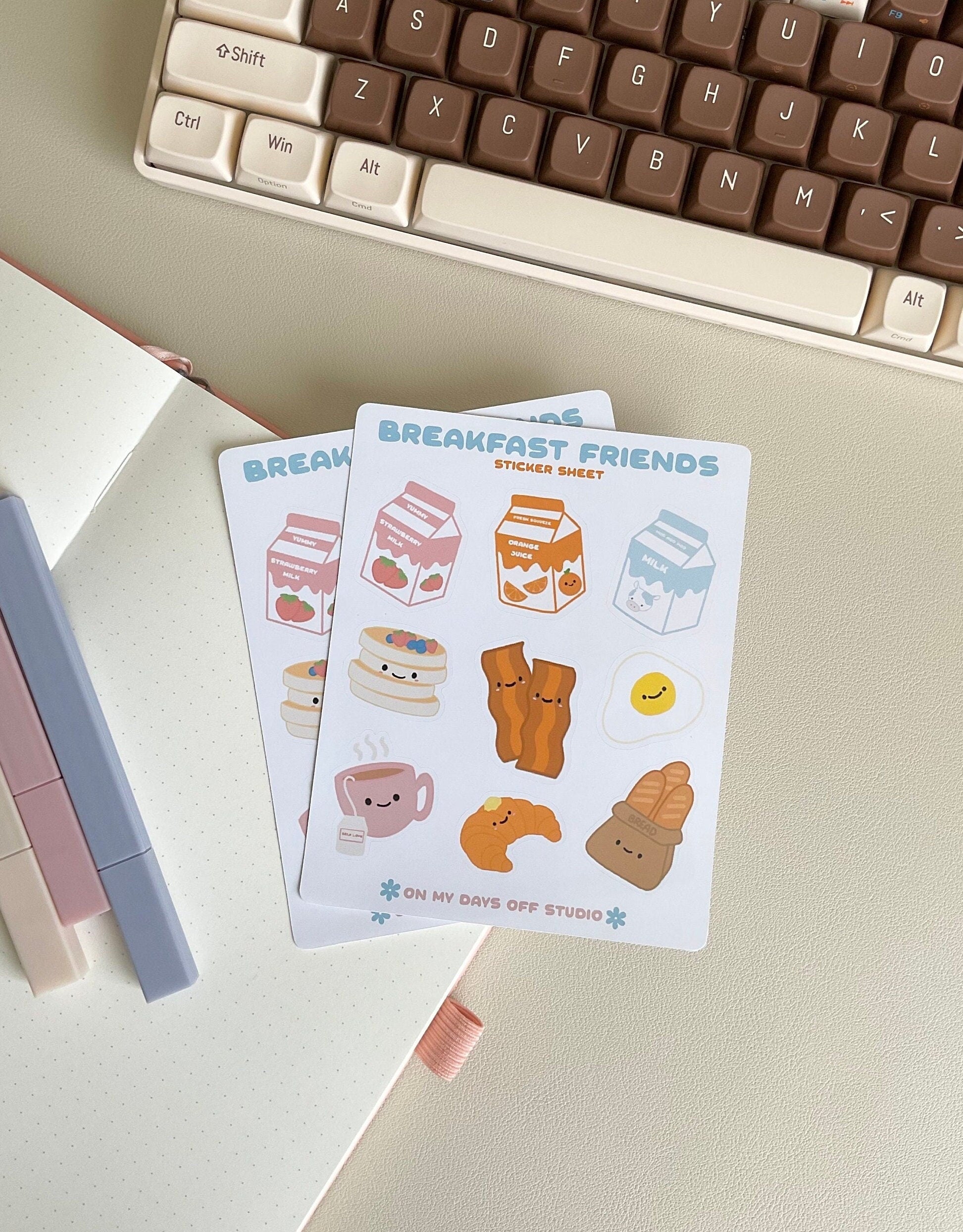 This Breakfast Friends stationery sticker sheet featured 9 kawaii breakfast food illustrations, including strawberry milk, orange juice, milk carton, pancakes, baccon, egg, croissant, tea and french bread. These glossy stickers are perfect for planners and bullet journals.&nbsp;