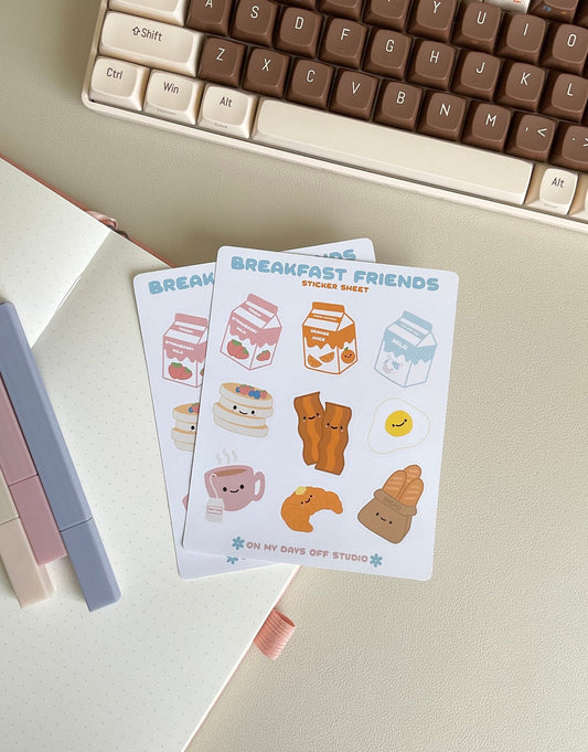 This Breakfast Friends stationery sticker sheet featured 9 kawaii breakfast food illustrations, including strawberry milk, orange juice, milk carton, pancakes, baccon, egg, croissant, tea and french bread. These glossy stickers are perfect for planners and bullet journals.&nbsp;