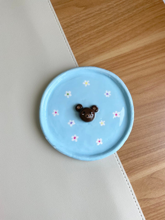 This cute tray can be used to hold your jewelry, a catch all dish or even just a decor piece. Features a 3D bear in the center and hand painted flowers.