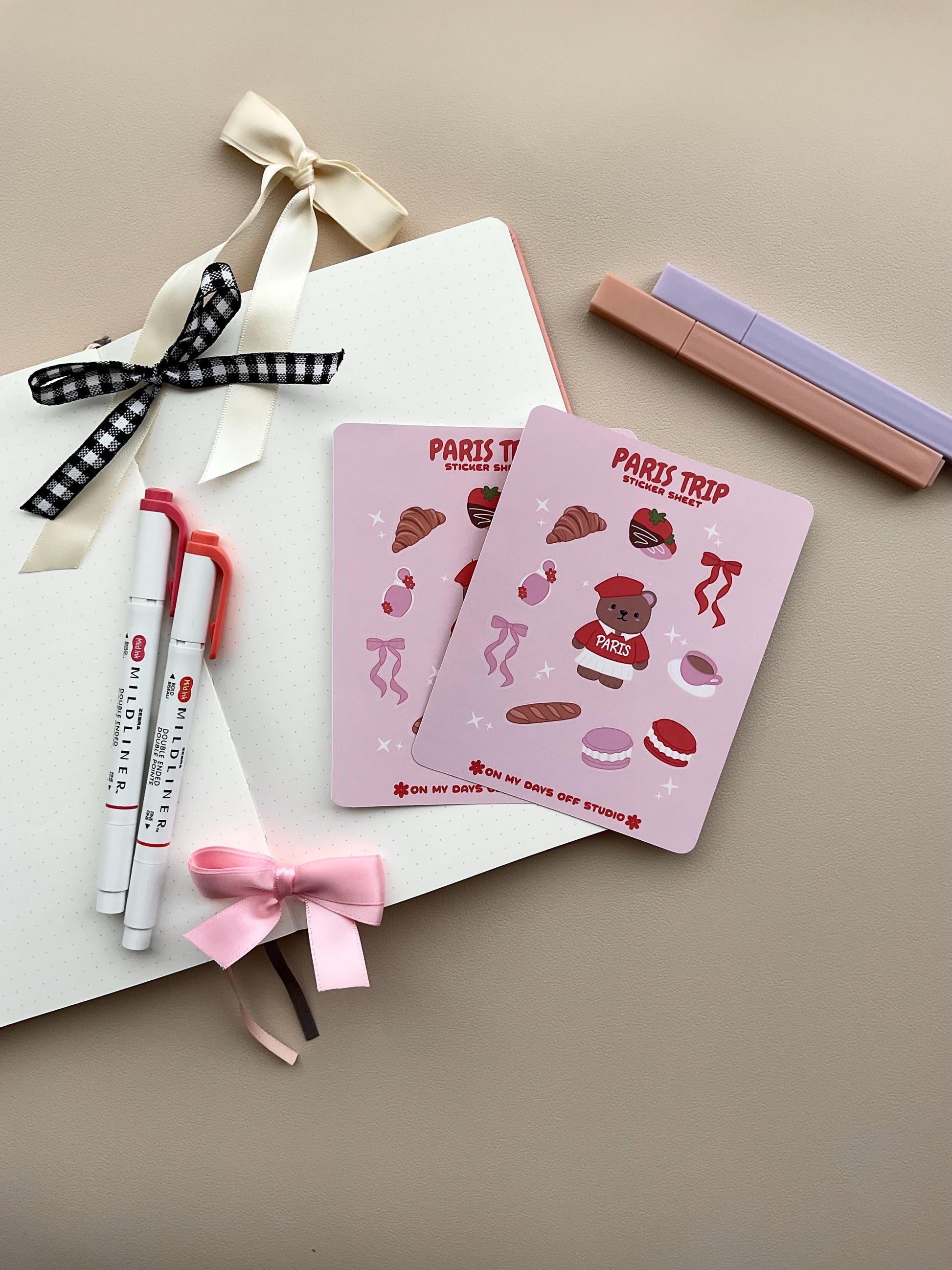 This stationery sticker sheet features a Paris Trip theme and has 10 colorful illustrations. This includes a bear in a Paris sweater, bows, chocolate dipped strawberries, croissant, perfume, macaroons and a french baguette. These glossy stickers are perfect for planners and bullet journals.&nbsp;