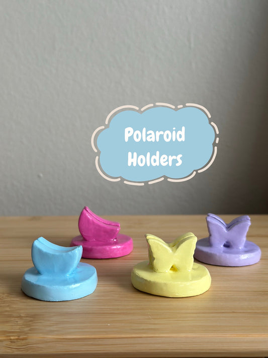  These mini clay polaroid holders are handmade, painted with acrylic paint &amp; sealed with high quality resin. They come in two shapes, butterflies and moons. 