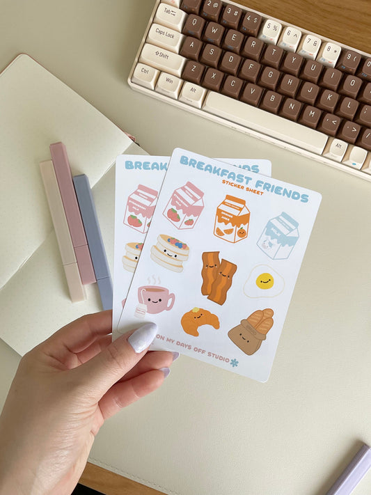 This Breakfast Friends stationery sticker sheet featured 9 kawaii breakfast food illustrations, including strawberry milk, orange juice, milk carton, pancakes, baccon, egg, croissant, tea and french bread. These glossy stickers are perfect for planners and bullet journals.&nbsp;