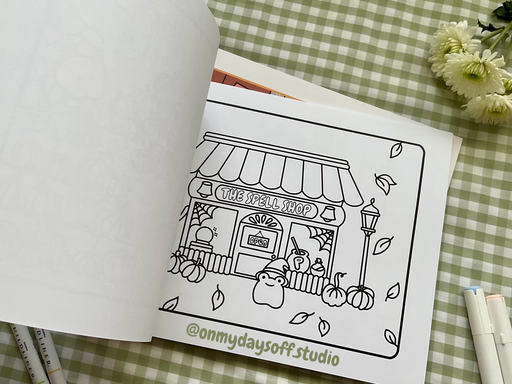 Juni & Friends Coloring Book Vol. 3 - the spell shop with pumpkins and a frog witch
