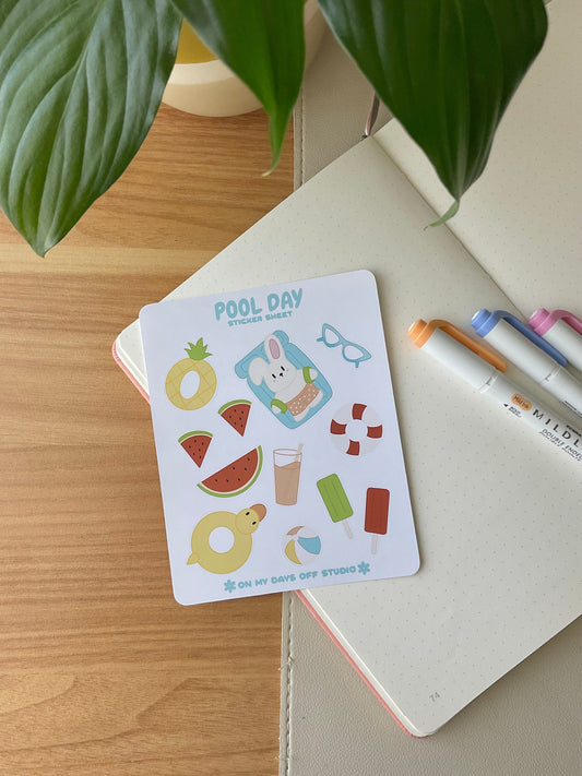 This stationery sticker sheet features a pool day theme and has 12 colorful illustrations. These adorable illustration includes a bunny in swim trunks, pool floats, watermelon, summer drinks, popsicles, and beach ball. These glossy stickers are perfect for planners and bullet journals.&nbsp;
